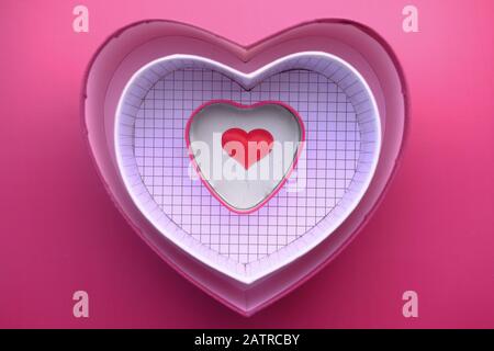 top view of heart shape gift box on red background  Stock Photo