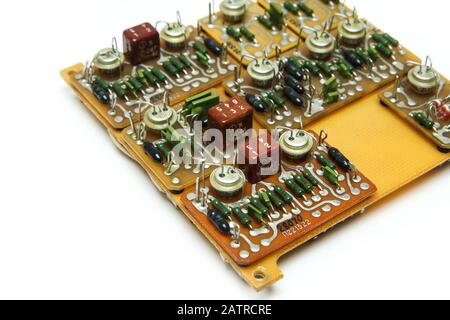 The old vintage circuit board with several electronic components. Stock Photo