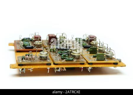 The old vintage circuit board with several electronic components. Stock Photo