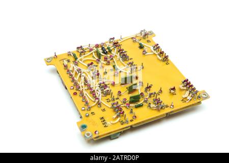 The old vintage circuit board with several electronic components. Stock Photo