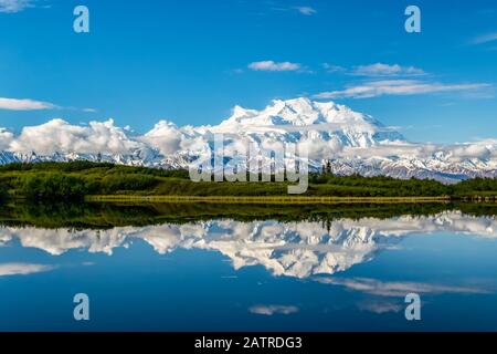 View of Denali and it's reflection in Reflection Pond taken from the park road while driving to Wonder Lake, Denali National Park and Preserve Stock Photo