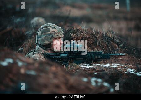 Bemowo Piskie, Poland. 04 February, 2020. A British Soldier, assigned to the Royal Scots Dragoon Guards, during a NATO live-fire exercise February 4, 2020 in Bemowo Piskie, Poland.  Credit: Sgt. Timothy Hamlin/Planetpix/Alamy Live News Stock Photo