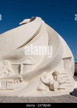 Argentina, Ushuaia. Ushuaia's Pioneers and First Settlers Monument, topped by an albatross with its wings covering the sculpture. Stock Photo