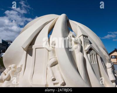 Argentina, Ushuaia. Ushuaia's Pioneers and First Settlers Monument, topped by an albatross with its wings covering the sculpture. Stock Photo