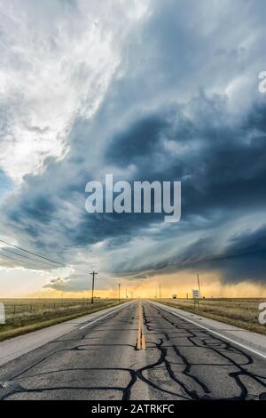 A low precipitation supercell crosses an empty highway near Roswell, New Mexico; Rowell, New Mexico, United States of America
