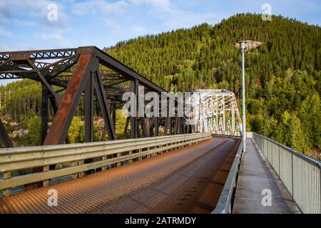 Old and new Skeena bridges going over Skeena River; Terrace, British Columbia, Canada Stock Photo