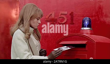 Fahrenheit 451 (1966) directed by François Truffaut and starring Julie Christie as Linda Montag, shown informing on her husband. Ray Bradbury’s dystopia world where books are banned and independent thought discouraged. Stock Photo