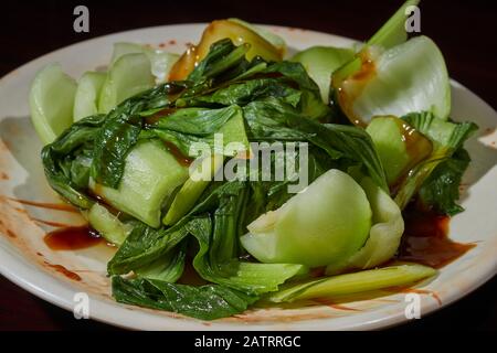 A plate of stir-firied baby bok choy.Chinese cuisine served in State College, Pennsylvania, USA Stock Photo