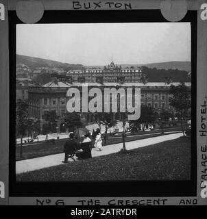 Buxton Crescent & Thermal Spa Hotel & Palace Hotel during the Victorian period c1890, Victorians in front of the Bath House, antique old glass magic lantern slide picture. The newly renovated hotel is due to open in 2020 creating a northern capital for health and wellbeing. Antique Magic Lantern Slide.  Original photographer unknown, copyright period expired.  Digital photography, restoration, editing copyright © Doug Blane. Stock Photo