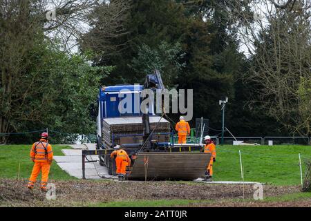 Denham, UK. 4 February, 2020. Engineers working on the HS2 high-speed rail link project prepare to unload a temporary roadway from a large truck. Planned works in the immediate vicinity are believed to include the felling of 200 trees and the construction of a roadway, Bailey bridge, compounds, fencing and a parking area. Credit: Mark Kerrison/Ģ����ý Live News Stock Photo