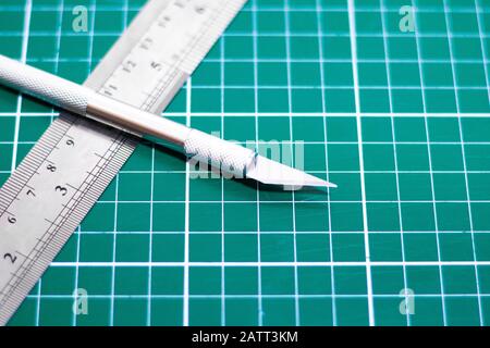 Exacto Knife Metal Ruler On Green Stock Photo 1119735713