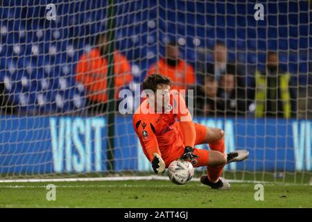 Cardiff, UK. 04th Feb, 2020. Sam Walker, the goalkeeper of Reading saves the 1st penalty in the penalty shoot-out. The Emirates FA Cup, 4th round replay match, Cardiff City v Reading at the Cardiff City Stadium on Tuesday 4th February 2020. this image may only be used for Editorial purposes. Editorial use only, license required for commercial use. No use in betting, games or a single club/league/player publications. pic by Andrew Orchard/Andrew Orchard sports photography/Alamy Live news Credit: Andrew Orchard sports photography/Alamy Live News Stock Photo