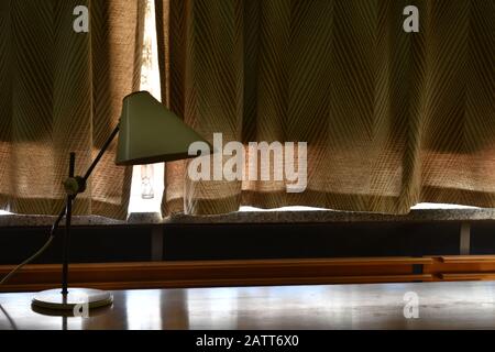 Lamp on a desk an old GDR DDR office in the former Stasi Headquarters in Lichetnberg Berlin Stock Photo