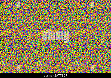 Colorful confetti background. Small dots in bold and saturated colors, randomly spread over a rectangular shaped black background to use seamless. Stock Photo