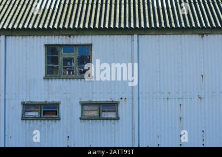 The Old Blue Boathouse By The Docks Stock Photo