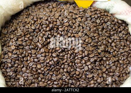 Photo of coffee beans in sack. Photographed in front of the market. Close up Stock Photo
