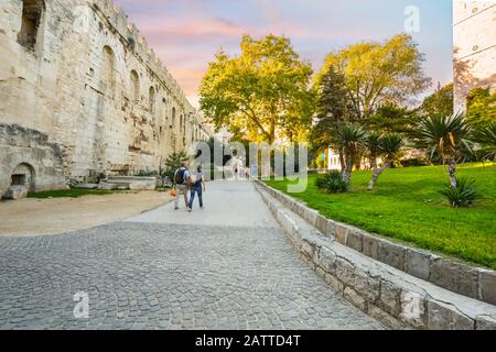 Tourists pass the Golden Gate or 'the northern gate', one of the four principal Roman gates into the stari grad Diocletian's Palace of Split Croatia. Stock Photo