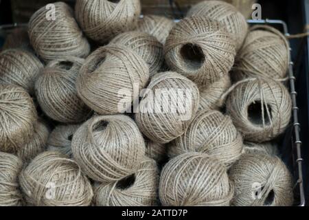 Round flax twine rope. There are a lot of round threads. It was taken in front of the market. Stock Photo