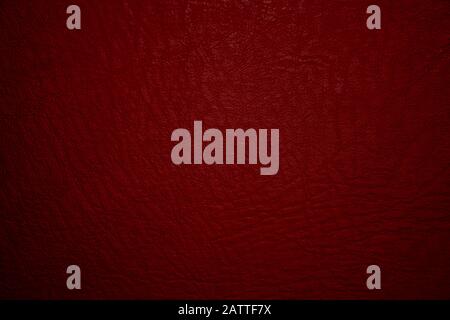 Dark red leather material texture, useful as background for design-works Stock Photo