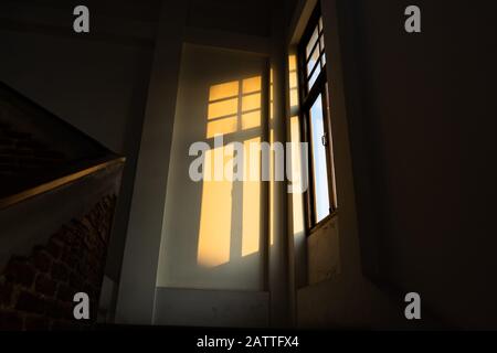 Sunlight from a window in a dark room Stock Photo