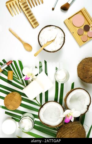 Coconut cosmetics theme flat lay creative layout overhead with pro environment alternative plastic free soaps, moisturizers and beauty products. Verti Stock Photo