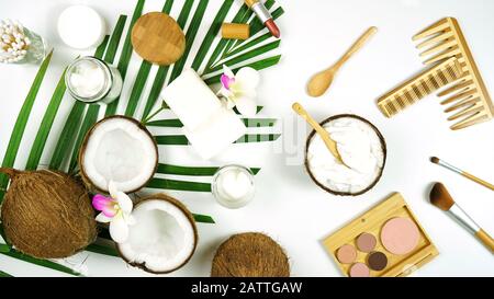 Coconut cosmetics theme flat lay creative layout overhead with pro environment alternative plastic free soaps, moisturizers and beauty products. Stock Photo