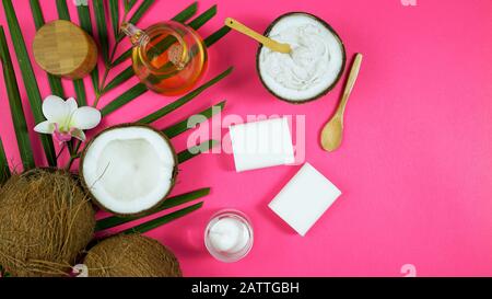 Coconut cosmetics theme flat lay creative layout overhead with pro environment alternative plastic free soaps, moisturizers and beauty products on mod Stock Photo