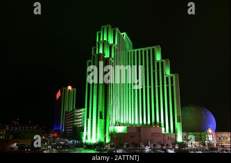 Reno, Nevada - January 17, 2020: Silver Legacy Resort Casino illuminated green at night in winter. Stock Photo