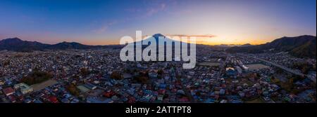 Aerial view panorama of mount Fuji in city at Fujiyoshida, Yamanashi, Japan. Fujisan on sanset. Stock Photo