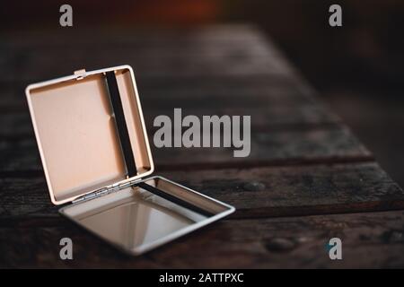 Cigarette case on the table in the outside. Concept of smoking. Stock Photo