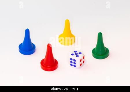 Four tokens with dice on white background Stock Photo