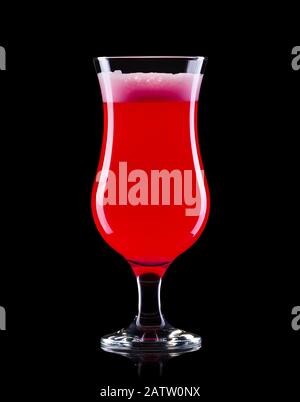 Strawberry cocktail in hurricane glass isolated on black background