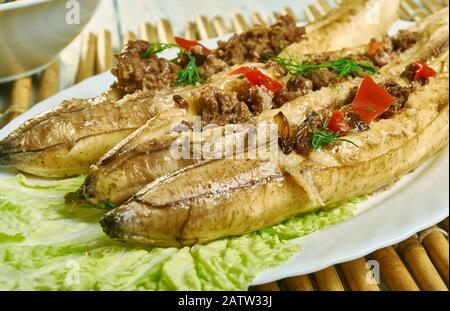 Puerto Rican  Stuffed Baked Plantains, roasted plantains filled with seasoned ground meat, tomatoes, onions, bell pepper, and spices Stock Photo