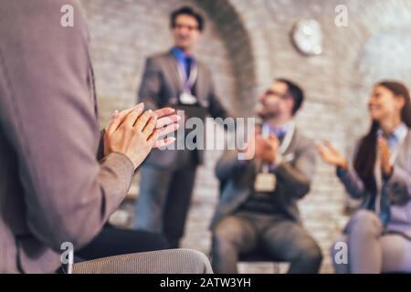 Successful business team is clapping their hands in modern office. Stock Photo