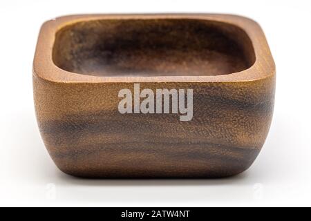 Close up a square wooden bowl isolate on white background. Stock Photo