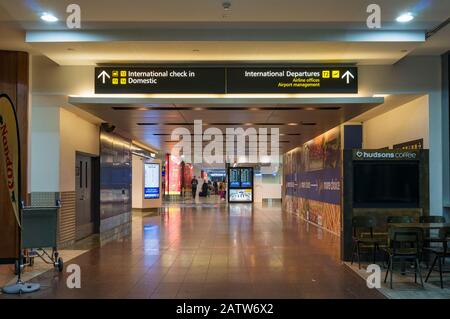 Melbourne, Australia - December 10, 2016: Hall and walkway in Melbourne airport with navigation boards to domestic airport, international check-in zon Stock Photo