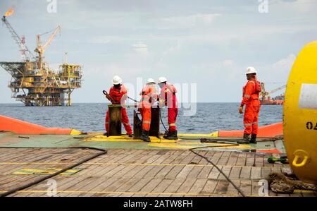 AHTS vessel marine crew carried out anchor handling operation on deck Stock Photo