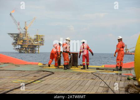 AHTS vessel marine crew carried out anchor handling operation on deck Stock Photo