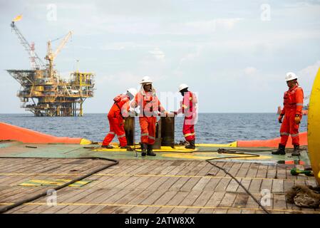 AHTS vessel marine crew carried out anchor handling operation on deck Stock Photo