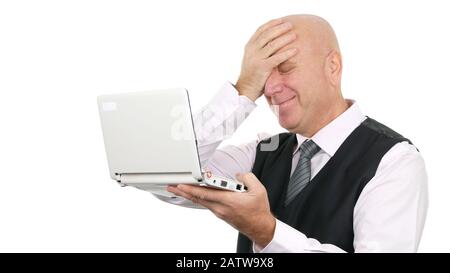 Happy Businessman Smile Reading Good Financial News on the Laptop Gesturing Surprised Stock Photo