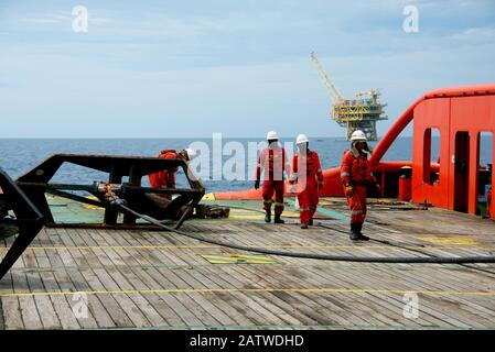 AHTS vessel marine crew carried out anchor handling operation on deck Stock Photo