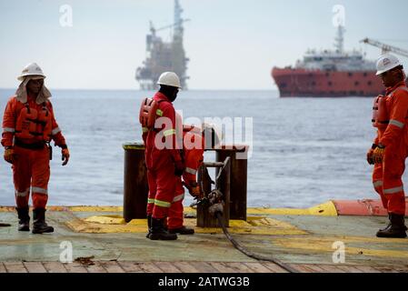 AHTS vessel marine crew carried out anchor handling operation on deck Stock Photo