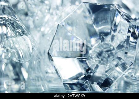 Abstract crystal objects with reflection of beam of light off the various glass planes Stock Photo