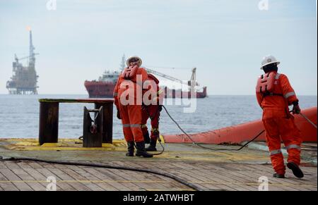 AHTS vessel marine crew carried out anchor handling operation on deck Stock Photo