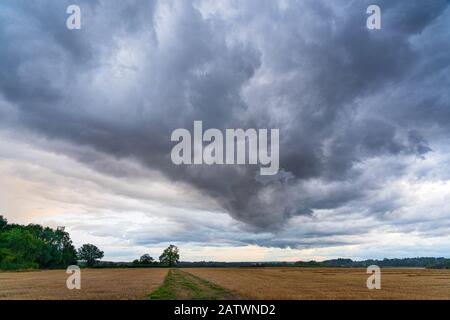 Storm clouds gathering in Perry Green, Much Hadham, Hertfordshire. UK Stock Photo