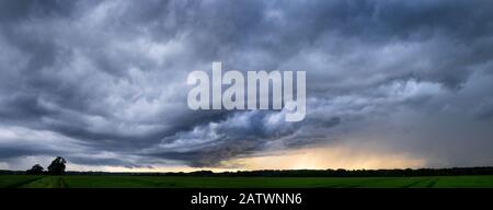 Dramatic storm clouds gathering in Perry Green, Much Hadham, Hertfordshire. UK Stock Photo