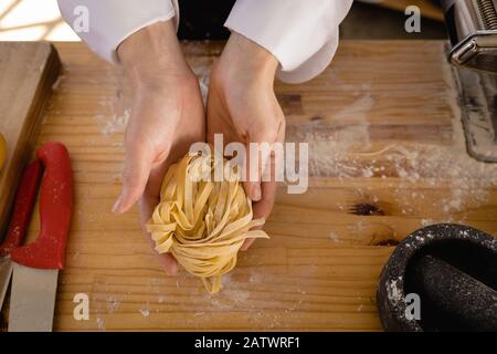 Caucasian chef making pasta Stock Photo