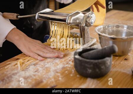 Caucasian chef making pasta Stock Photo