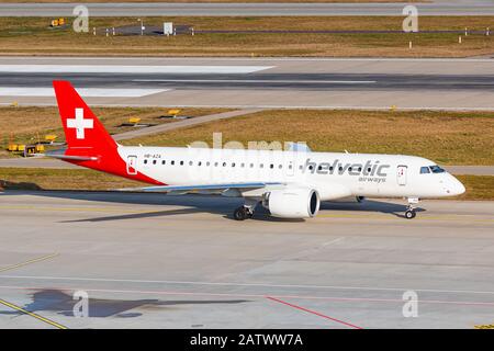 Zurich, Switzerland - February 1, 2020: Helvetic Airlines Embraer E190-E2 airplane at Zurich airport (ZRH) in Switzerland. Airbus is an aircraft manuf Stock Photo