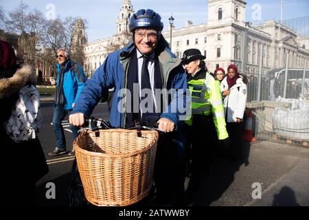 LONDON, UK. 5th Feb, 2020. Andrew Mitchell Conservative MP for for Sutton Coldfield arrives at Parliament on his bicycle to attend PMQ's Prime Minister Questions. Credit: amer ghazzal/Alamy Live News Stock Photo